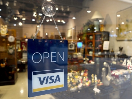 Visa quarterly profit fell 76%